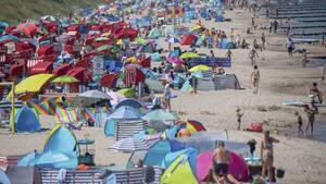 crowded beach sex - No Sex On The Beach: Netherlands Town To Sunbathers - Oneindia News