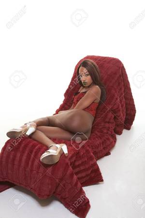 african glamour models nude - young semi naked African-American female glamour model without underwear  panties in red lingerie sitting