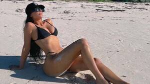 couple walking on beach nude butt - Kim Kardashian Bares Booty in Black Bikini Top Amid Pete Romance