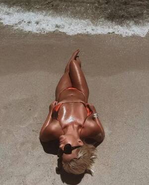 naked beach tan body - Page 3 babe gets 'hot' at the beach as she tops up her tan in tiny swimsuit  - Daily Star