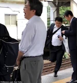 Busty Japanese Schoolgirl Porn - Japanese schoolgirls chase down a 'chikan' - men who grope women on trains  - on a station platform | Daily Mail Online