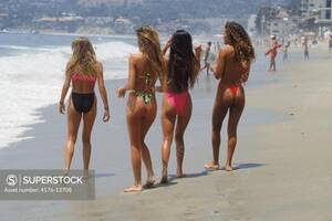 laguna beach babes nude - Four girls in bikinis walking along sandy Laguna Beach shore in Southern  California - SuperStock