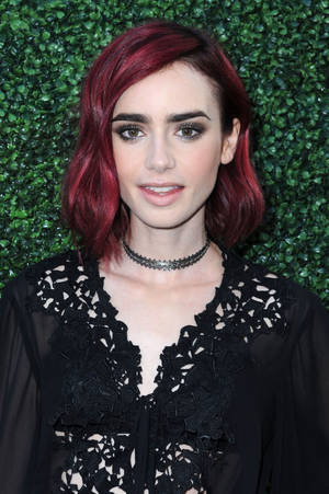 Bright Red Hair - Lily's new raspberry red locks were paired with an intense smoky eye and a  pretty nude lip that perfectly complemented her new style.