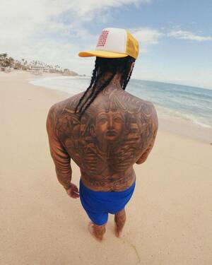 candid beach sex partypics - Tyga fans react to his 'insane' butt tattoo: 'Kiss my a--'