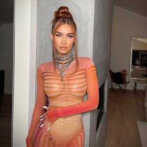Megan Fox Boobs Porn - Megan Fox flaunts her curves as she goes braless in see-through orange  dress for very sexy new pics | The Sun