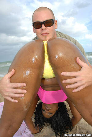 ebony beach thong - This smokin hot ebony babe takes the thong to the beach and shows us how it  is