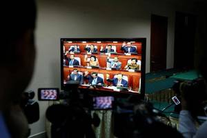 Espionage Porn - A journalist records footage of a TV screen while Cambodia's parliament  votes to allow the prosecution of opposition leader Kem Sokha on treason  charges in ...