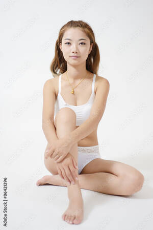 asian junior idol video - Sexy woman looking at camera Stock Photo | Adobe Stock