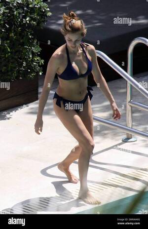 Melissa Theuriau Body Xxx - Exclusive!! Jamel Debbouze and his adoring wife Melissa Theuriau spend a  romantic day by the pool cuddling and kissing. The new parents, who had a  son on 3 December 2008 called Leon,