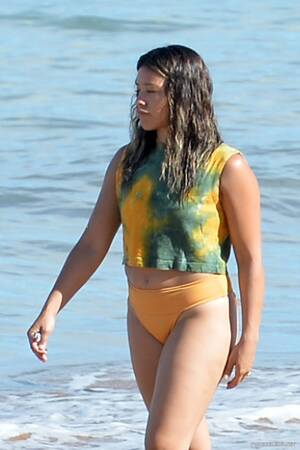 Actress Gina Rodriguez - Gina Rodriguez Yellow Bikini Beach Photos - NuCelebs.com
