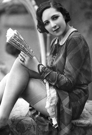 1920s Vintage Women - Vintage risquÃ© garter belt and stockings woman reading book