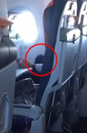 In Airplane - Shocking moment randy plane passenger watches porn and starts pleasuring  himself on board busy plane | The Irish Sun