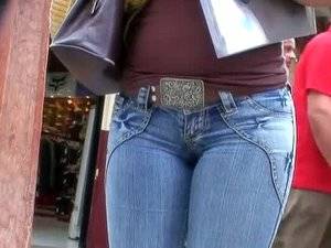 lamm in tight jeans - Hot body girl in walking the street with a voyeur behind her