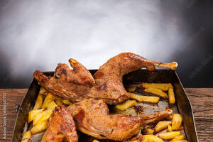 Black Food Porn - Roast chicken with potatoes on a wooden table. Black background. Porn food  Stock Photo | Adobe Stock