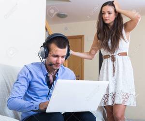 Husband And Wife Watch Porn Together - Furious wife catching husband watching porn at home Stock Photo - 47625572