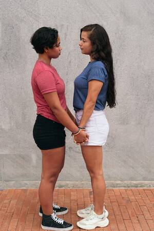 lesbian hispanic girls naked - Premium Photo | Latina lesbian couple stare at each other during a date in  the city
