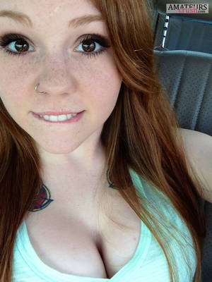 cute redhead - cute lips biting of busty redhead