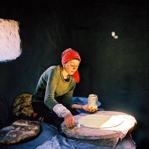 European Village Women Porn - Woman baking bread in tandoor. Khinaliq Village. Azerbaijan. June, 2006. The