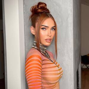Megan Fox Boobs Porn - Megan Fox flaunts her curves as she goes braless in see-through orange  dress for very sexy new pics | The Sun