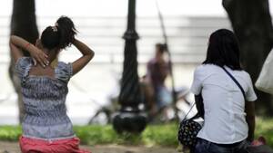 Cambodian Sex Industry - Cambodian sex workers wait for customers at a public park in Phnom Penh on  July 20