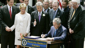John Walsh Teacher Sex Porn - With John and Reve Walsh watching, President George W. Bush signs the Adam  Walsh