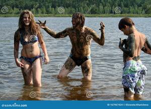 Family Nudist Girls Hairy Pussy - Dad, Daughter and Son Wash Away the Healing Mud in the Lake. Russian Family  on Treatment Stock Photo - Image of happy, nature: 167967424