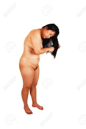 black and white asian nudes - A beautiful Asian woman standing nude in the studio for white backgroundand  brushing her long black