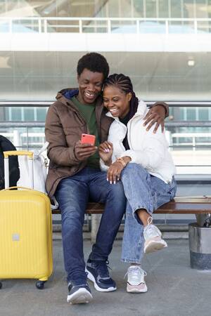 black funny videos - Premium Photo | African couple of tourists wait for taxi at airport  laughing from funny videos on smartphone