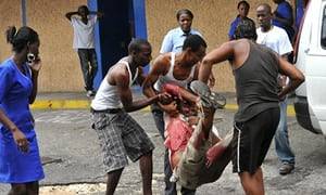 Kingston Jamaica Slum Porn - A wounded man is carried to hospital in Kingston during clashes with police  and troops.