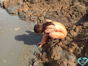 black sea beach nude - Felicity scooping up mud at the Dead Sea nude beach by Young Naturists and  Young Nudists America - YNA.