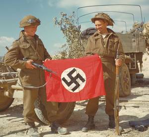 Nazi French Porn - Two Canadian soldiers showing off a Nazi Germany flag in Normandy, France  in 1944.