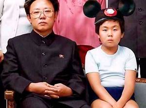 bad boy school - Kim, now around seven, with his father, in a widely circulated photo;