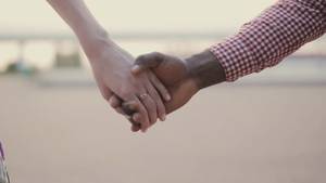 interracial couples holding hands - 0:08 two interracial lovers joining hands