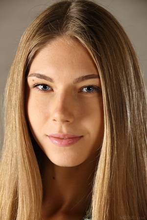 Anya Russian Porn Star - Pretty blonde Anjelica posing naked on sofa.