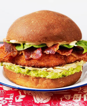 Baby Chicken Porn - Chicken Schnitzel Burger > Chicken Breast brined and crumled,garnished with  guacamole & chipotle slaw