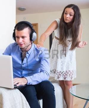 Home Porn Youngest - Furious young wife catching husband watching porn at home photo